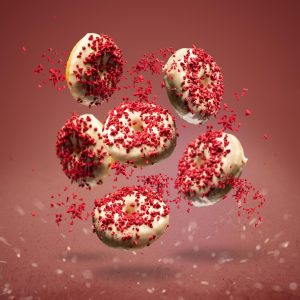 flying-donuts-glazed-with-white-chocolate-decorated-with-lyophilized-strawberries-red_573717-17