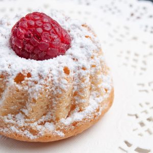 front-close-view-delicious-cake-with-cream-red-raspberry-white-tissue-cake-fruit-biscuit_140725-27476-2