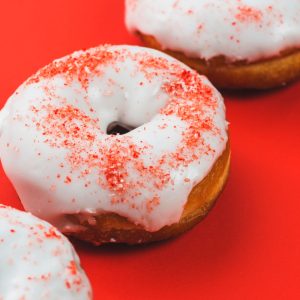 tasty-doughnuts-with-white-coating-sprinkles_23-2147895889